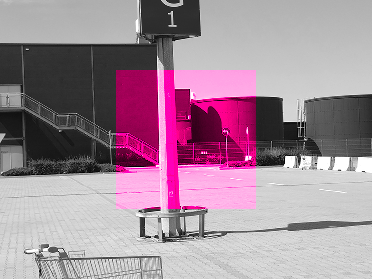 photo of urban parking lot with pink sqare in the middle of the picture